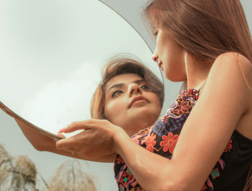 woman looking in the mirror