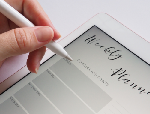 woman organising weekly planner on ipad